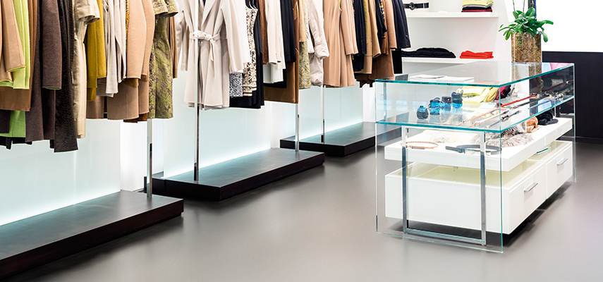 Polyflor Bloc in clothes shop in colour Clay Deep