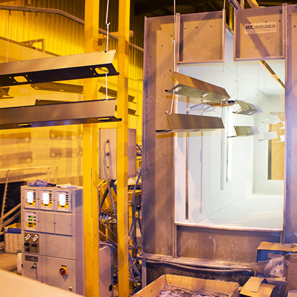 Steel being coated at Elite Furniture factory