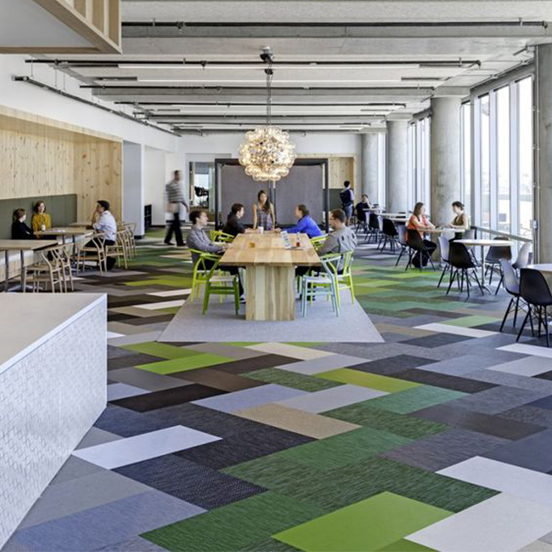 Unique pattern using different shades of grey and green carpet tiles