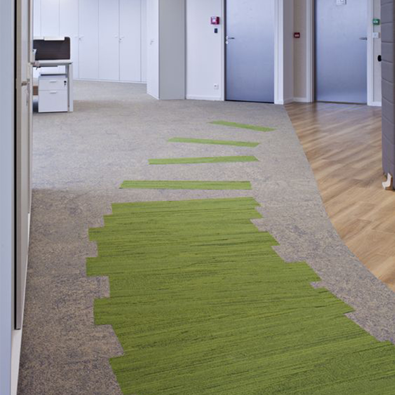 Pathway created using green carpet planks