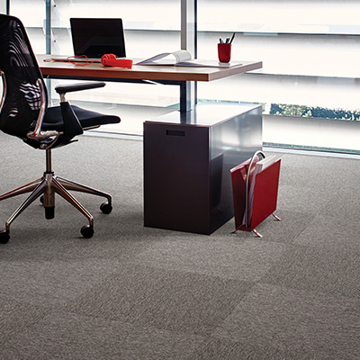 Interface Output Micro carpet tiles in an office with desk and chair